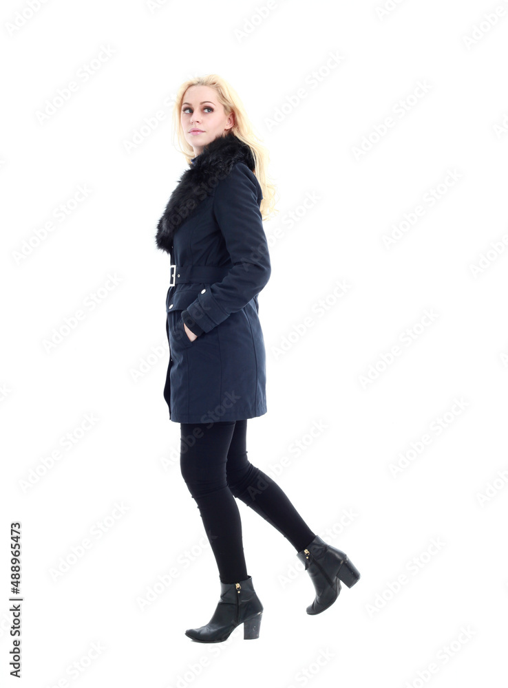 full length portrait of blonde woman wearing long winter coat. and casual clothes. standing pose, isolated on a white studio background. full length portrait of blonde woman wearing long winter coat. and casual clothes. standing pose, isolated on a white studio background.