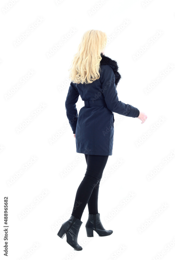 full length portrait of blonde woman wearing long winter coat. and casual clothes. standing pose, isolated on a white studio background. full length portrait of blonde woman wearing long winter coat. and casual clothes. standing pose, isolated on a white studio background.