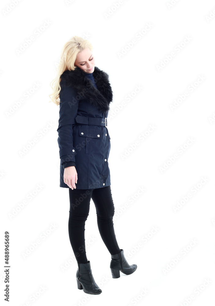 full length portrait of blonde woman wearing long winter coat. and casual clothes. standing pose, isolated on a white studio background. full length portrait of blonde woman wearing long winter coat. and casual clothes. standing pose, isolated on a white studio background.