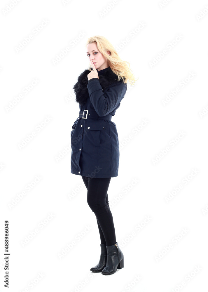 full length portrait of blonde woman wearing long winter coat. and casual clothes. standing pose, isolated on a white studio background. full length portrait of blonde woman wearing long winter coat. and casual clothes. standing pose, isolated on a white studio background.