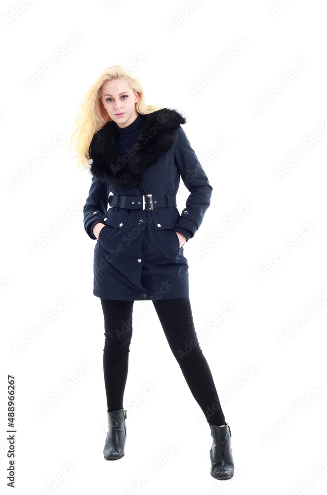 full length portrait of blonde woman wearing long winter coat. and casual clothes. standing pose, isolated on a white studio background. full length portrait of blonde woman wearing long winter coat. and casual clothes. standing pose, isolated on a white studio background.
