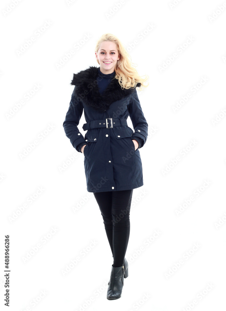 full length portrait of blonde woman wearing long winter coat. and casual clothes. standing pose, isolated on a white studio background. full length portrait of blonde woman wearing long winter coat. and casual clothes. standing pose, isolated on a white studio background.