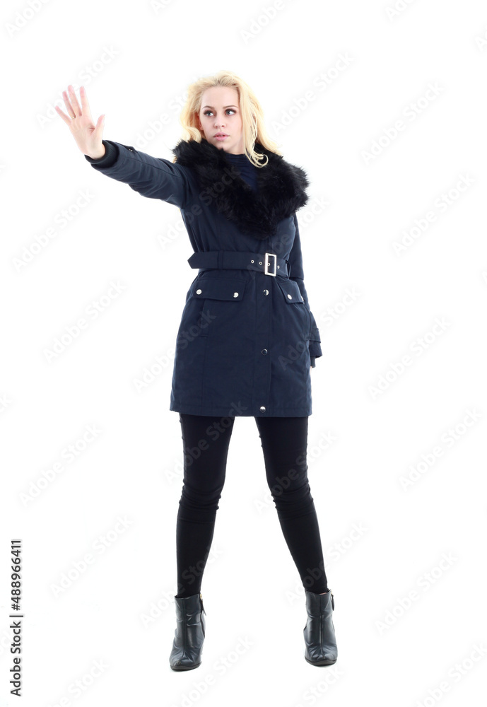 full length portrait of blonde woman wearing long winter coat. and casual clothes. standing pose, isolated on a white studio background. full length portrait of blonde woman wearing long winter coat. and casual clothes. standing pose, isolated on a white studio background.