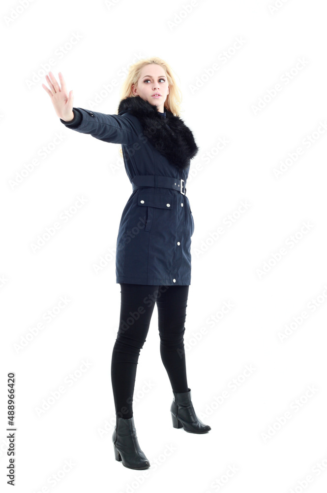 full length portrait of blonde woman wearing long winter coat. and casual clothes. standing pose, isolated on a white studio background. full length portrait of blonde woman wearing long winter coat. and casual clothes. standing pose, isolated on a white studio background.
