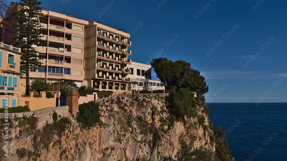 Obraz na płótnie Beautiful view of the historic center of Monaco (Monaco-Ville) at the mediterranean coast with residential apartment buildings on a rocky cliff. w salonie
