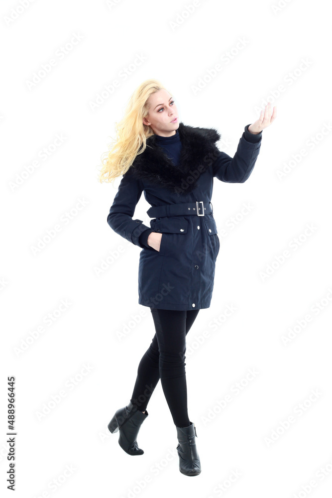 full length portrait of blonde woman wearing long winter coat. and casual clothes. standing pose, isolated on a white studio background. full length portrait of blonde woman wearing long winter coat. and casual clothes. standing pose, isolated on a white studio background.