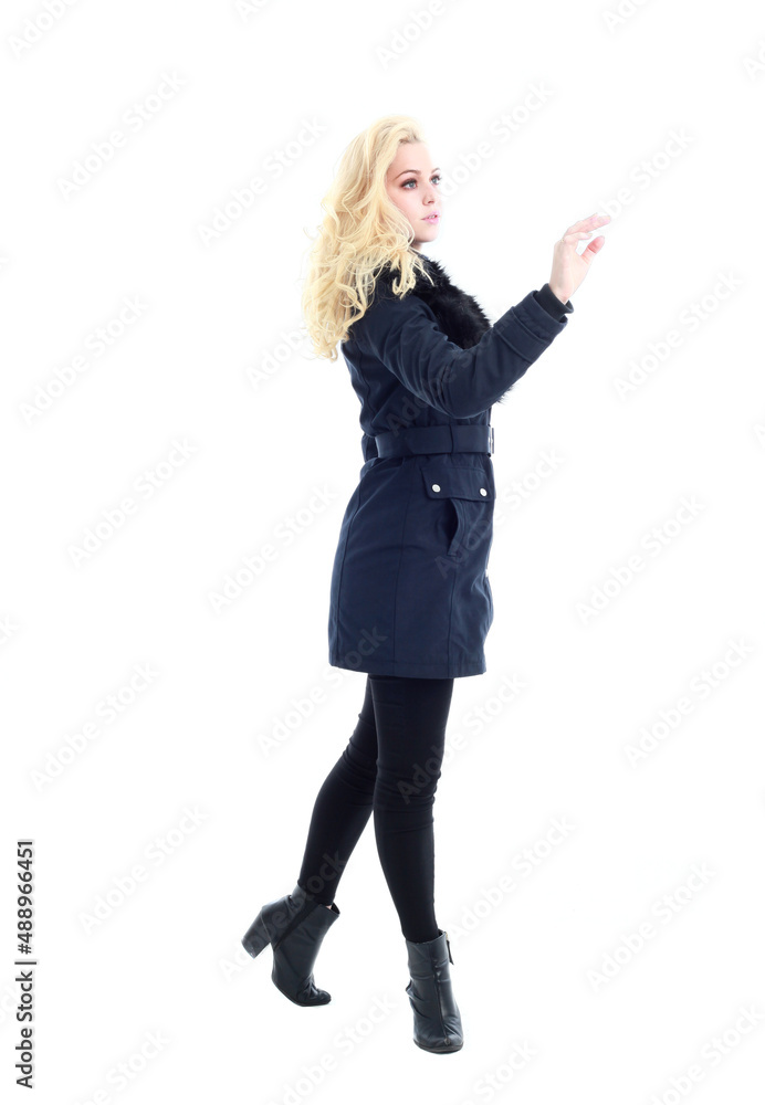 full length portrait of blonde woman wearing long winter coat. and casual clothes. standing pose, isolated on a white studio background. full length portrait of blonde woman wearing long winter coat. and casual clothes. standing pose, isolated on a white studio background.