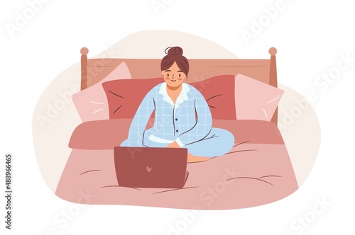 Girl using laptop in bed wearing pajamas. Empowered business woman or freelancer working on computer at home. Flat vector illustration.