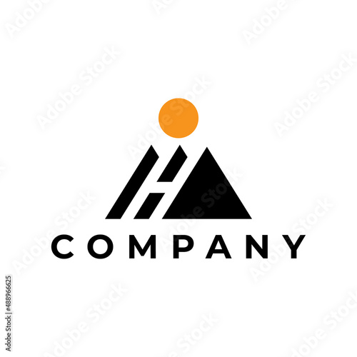 letter H mountain with sun logo design photo