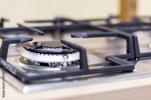 Gas stove burner close-up on a blurred background