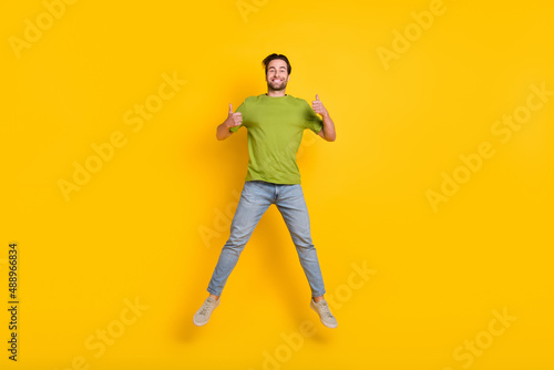 Full length photo of young man jumper show fingers thumb-up ad promo suggest approve isolated over yellow color background