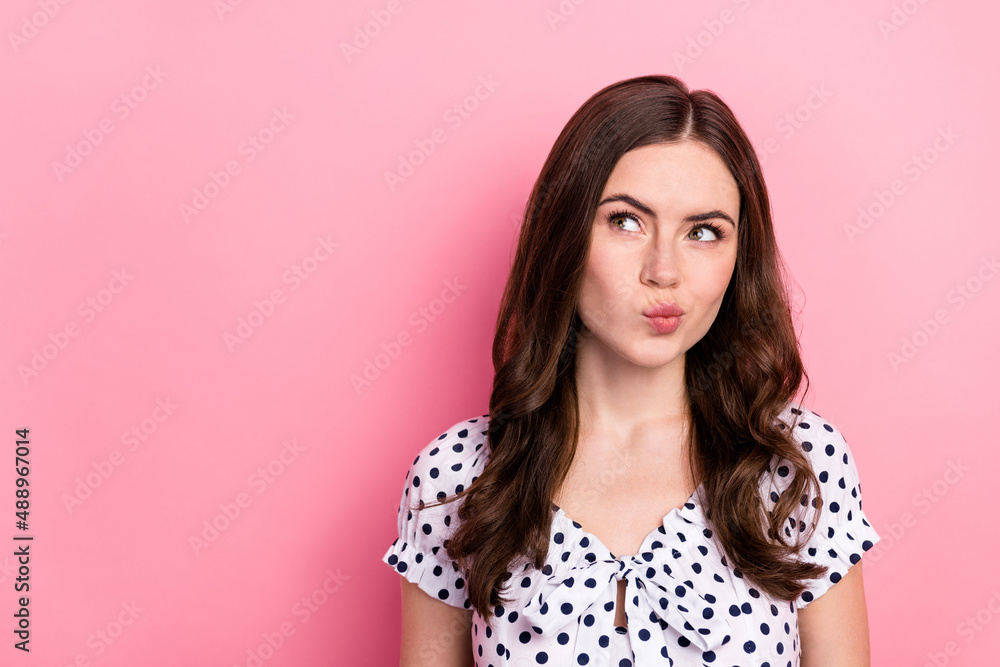 Portrait of attractive cunning wavy-haired woman overthinking copy space pout lips isolated over pink pastel color background Portrait of attractive cunning wavy-haired woman overthinking copy space pout lips isolated over pink pastel color background