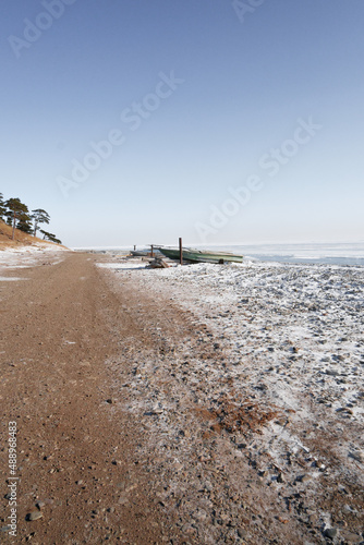 boat in winter landscape snow covered