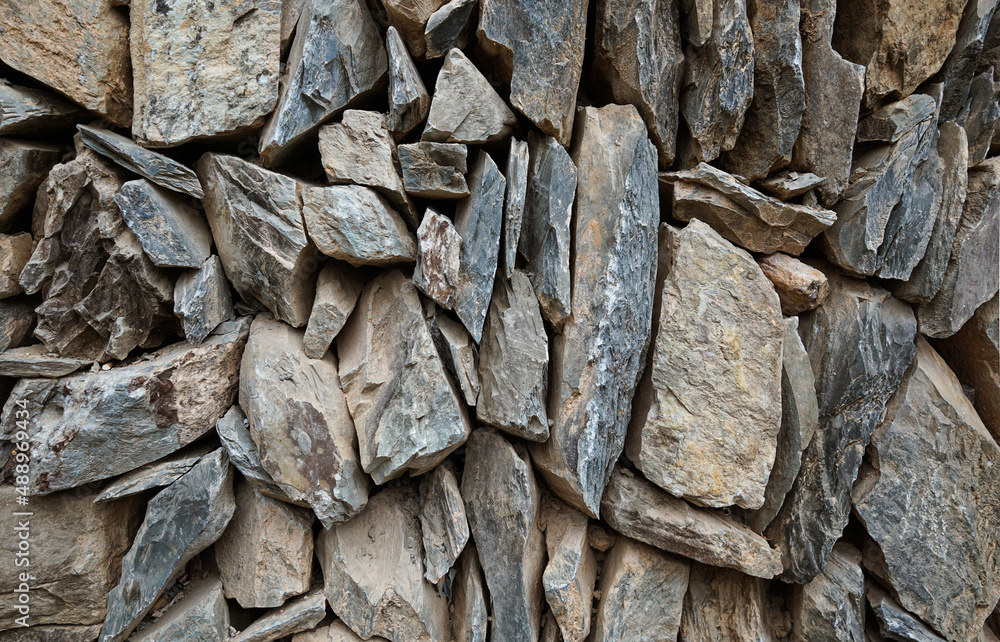 Stacked and compressed rock (slate) wall of various shapes and sizes; Guilin, China Stacked and compressed rock (slate) wall of various shapes and sizes; Guilin, China