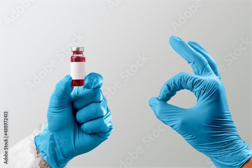 Medical doctor hands with covid-19 booster shot