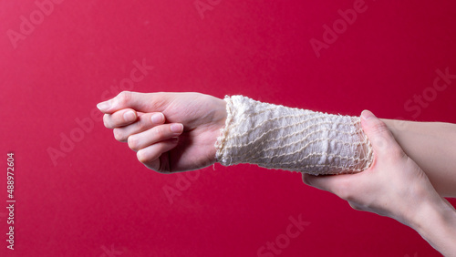 woman's hand bandaged with a medical bandage