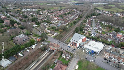 Pull back reveal Chigwell Essex UK drone aerial view High street and residential roads photo