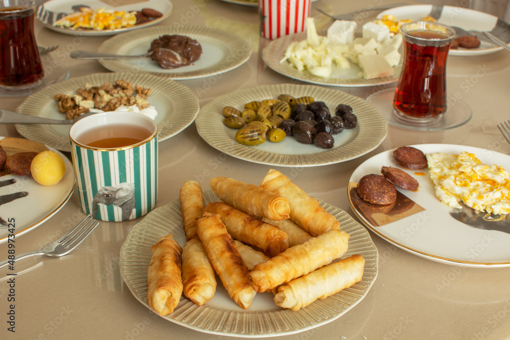 Classic Turkish home breakfast. Cigarette pastry (in Turkish ''sigara boregi'') , cheeses, olives, eggs, sausage, black tea. Classic Turkish home breakfast. Cigarette pastry (in Turkish ''sigara boregi'') , cheeses, olives, eggs, sausage, black tea.