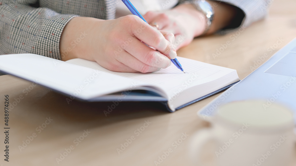 Business woman working at office with documents on her desk, Business woman holding pen and papers making notes in documents on the table, Hands of financial manager taking notes Business woman working at office with documents on her desk, Business woman holding pen and papers making notes in documents on the table, Hands of financial manager taking notes
