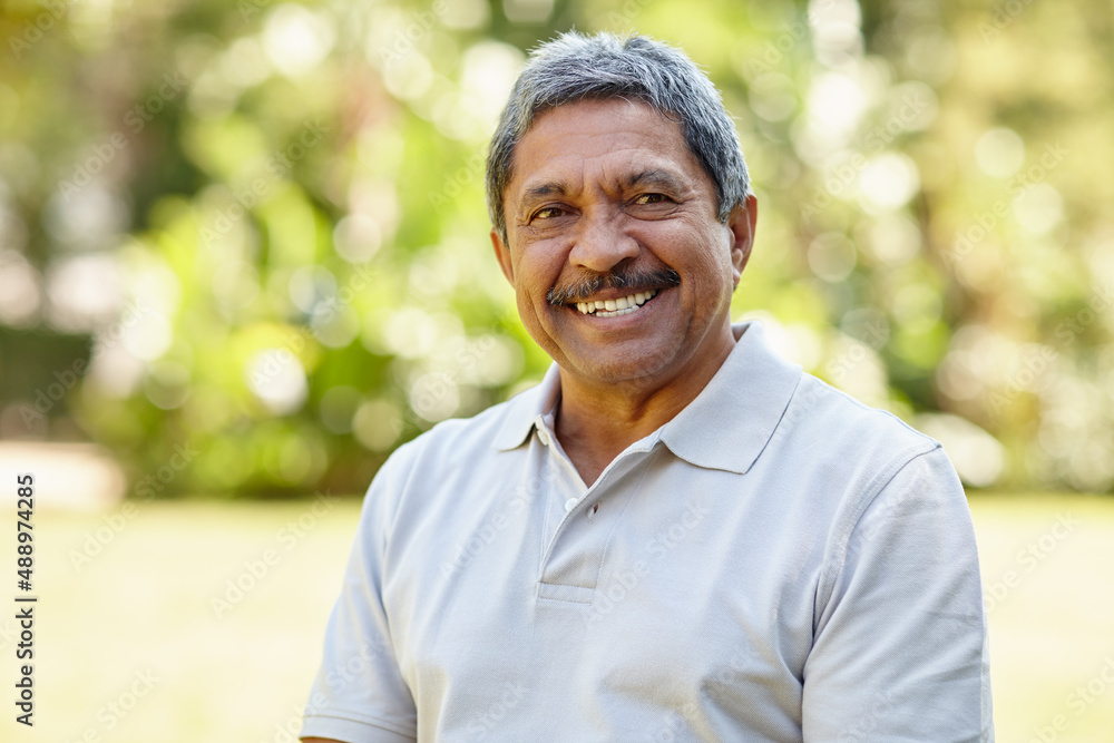 The golden years are great. Portrait of a happy senior man enjoying a day outdoors. The golden years are great. Portrait of a happy senior man enjoying a day outdoors.
