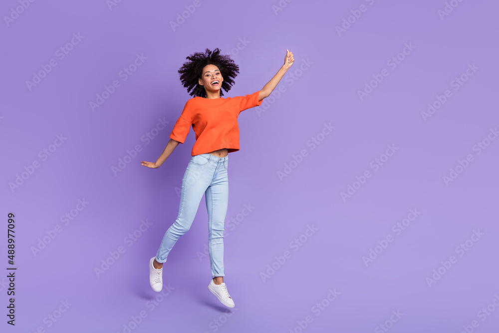 Full size photo of jumping girl traveling hold invisible umbrella rain concept isolated on purple color background