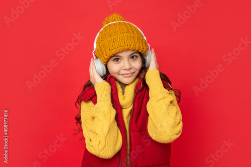 cheerful kid wear warm clothes. express positive emotion. winter fashion.