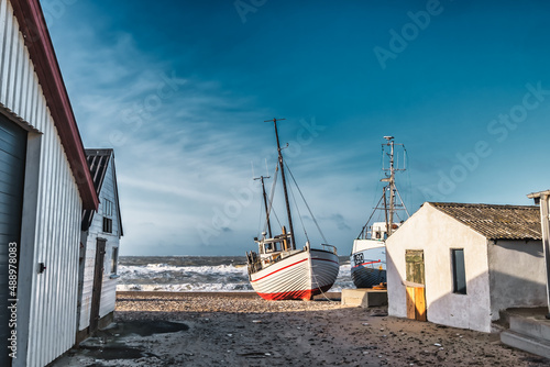 Small fishing boats on the landing place of Lild beach at the North sea coast, Denmark