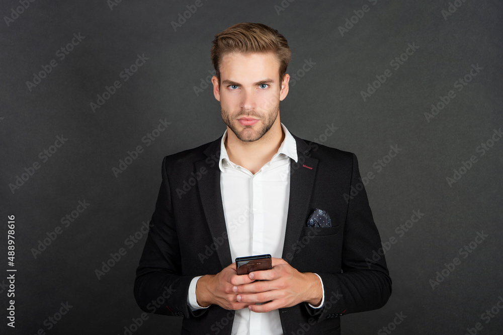 man in suit blogging online on phone, blog man in suit blogging online on phone, blog
