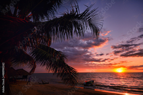 boat at sunset at a tropical beach