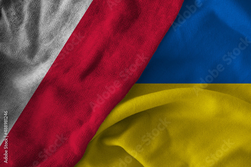 Concept of the relationship between Ukraine and Poland with two flags over each other