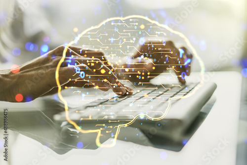 Double exposure of creative human brain microcircuit with hand typing on computer keyboard on background. Future technology and AI concept