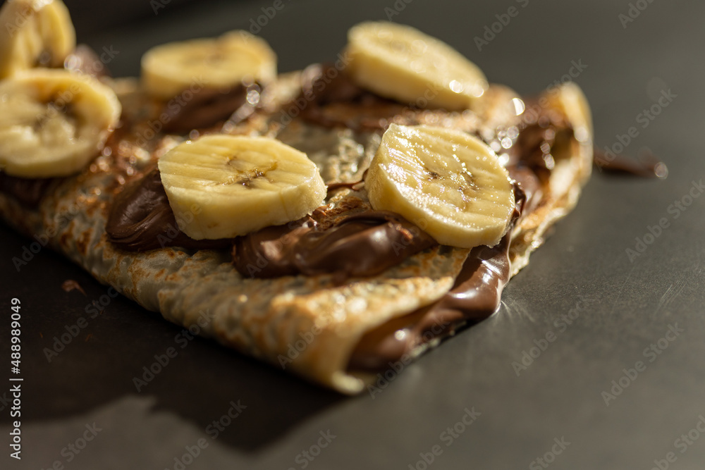 European pancake with chocolate cream and banana European pancake with chocolate cream and banana