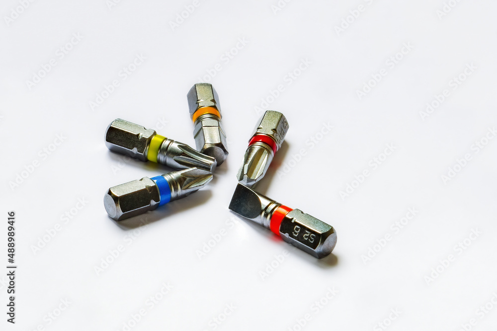 A set of bits for a screwdriver closeup white background A set of bits for a screwdriver closeup white background