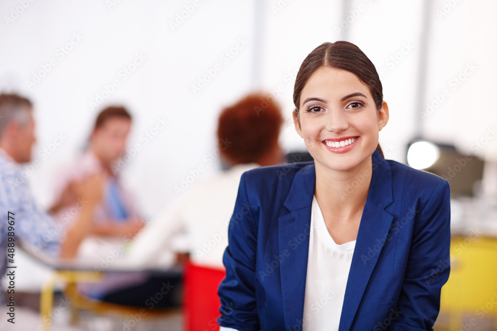 Young and ambitious. Cropped portrait of an attractive young businesswoman sitting in her office. Young and ambitious. Cropped portrait of an attractive young businesswoman sitting in her office.