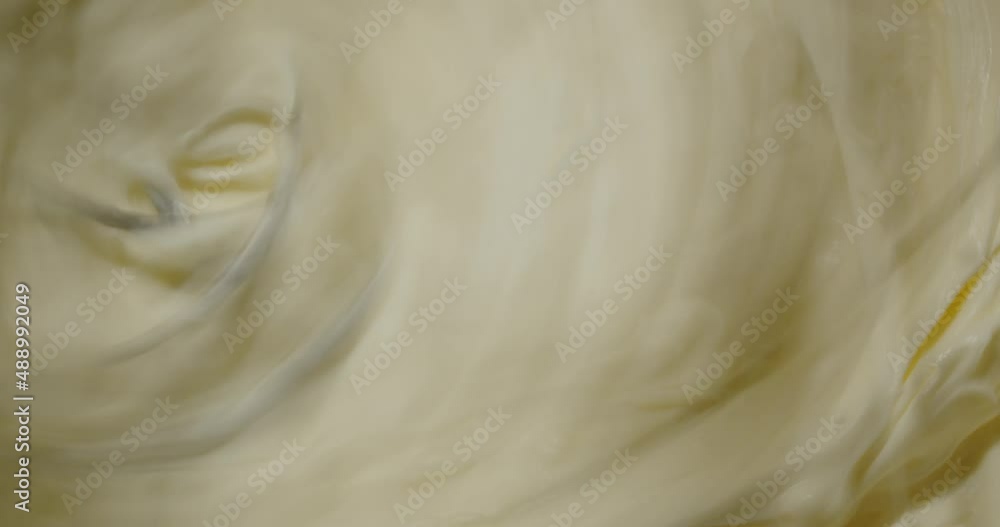 Confectionery mixer whips a thick homogeneous cream for the cake Confectionery mixer whips a thick homogeneous cream for the cake