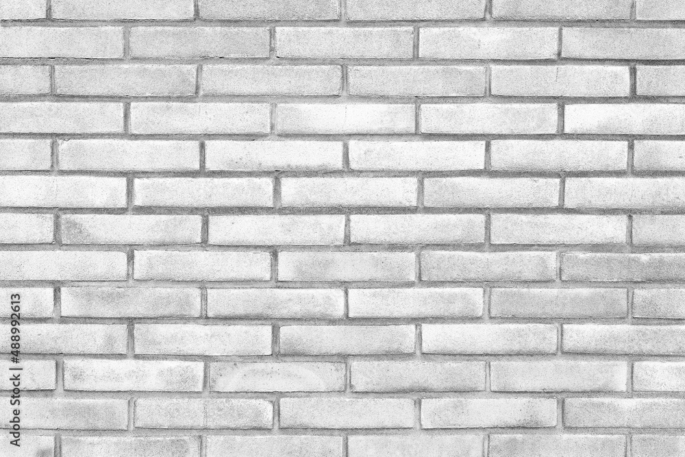 White exposed brick wall background texture without plaster