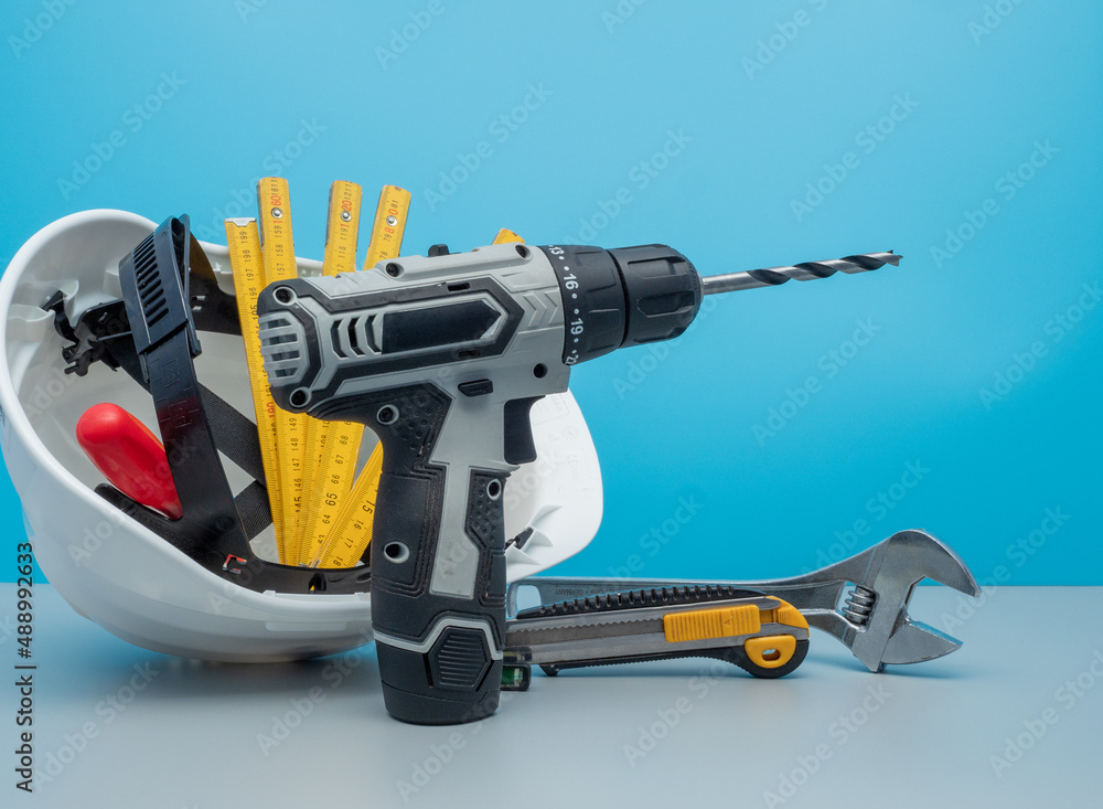 White construction helmet and construction tools. White construction helmet and construction tools.