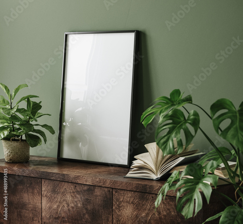 Mock up poster frame on commode with flowers in interior background, 3d render