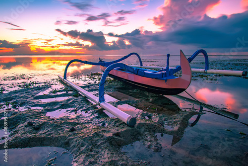 Fishing boat at karang beach on a beautiful sunrise.