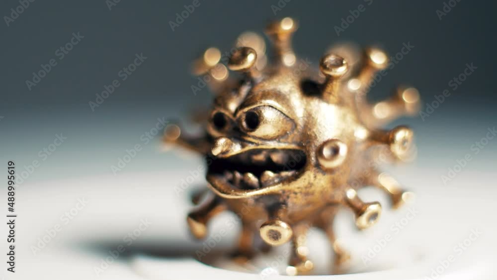 An angry virus spins slowly. Concept disease and pandemic An angry virus spins slowly. Concept disease and pandemic