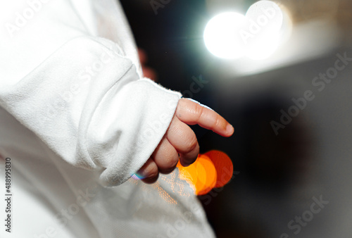 The sacrament of the baptism of a child in an Orthodox church, the priest anoints the baby's feet with holy oil.