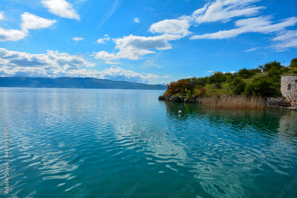 Fototapeta premium Blue sky, lake and trees. Lake Ohrid in North Macedonia