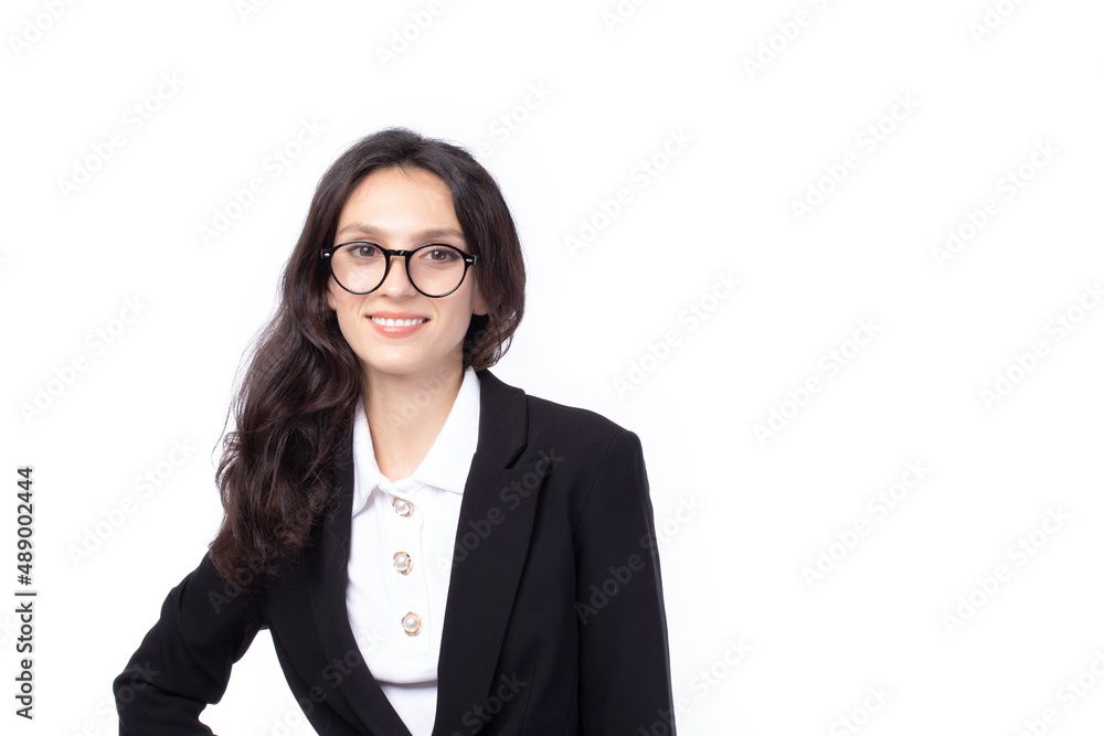 Portrait confident young attractive business woman. Confident young manager wearing black suit looking friendly and smiling isolated on white background. Business woman concept.