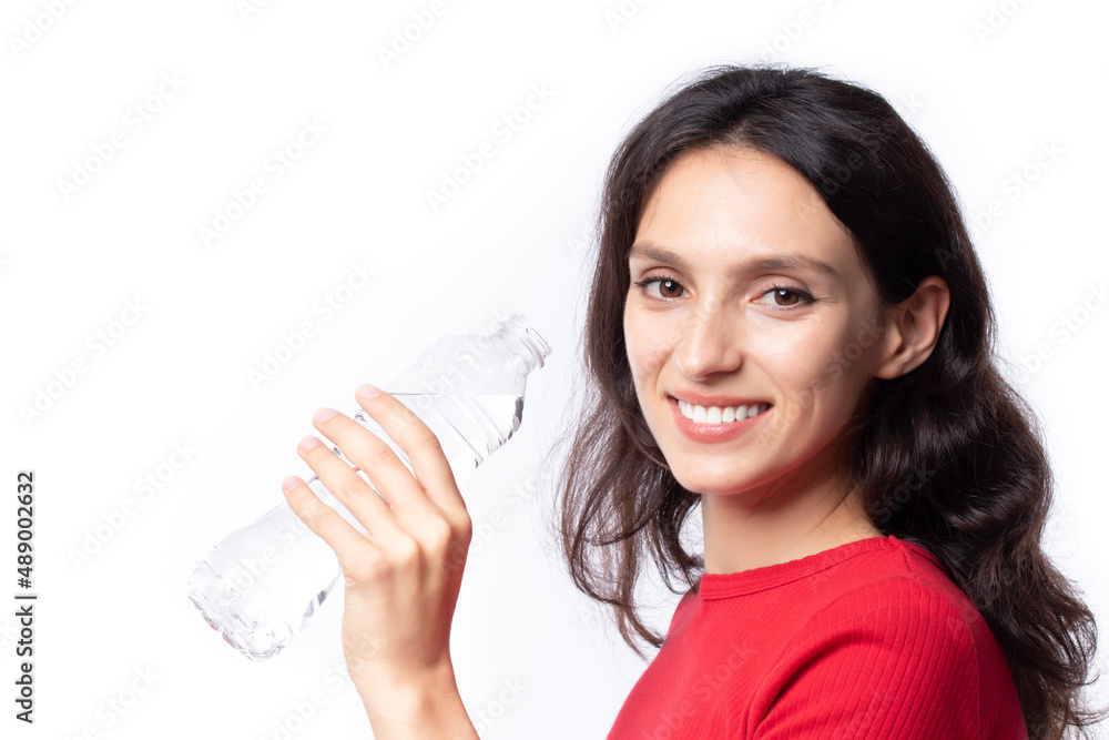 Beautiful young woman wearing red shirts are drinking water refreshing in the morning isolated on white background. Beautiful young woman wearing red shirts are drinking water refreshing in the morning isolated on white background.