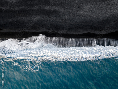Aerial view of the famous Reynisfjara black beach in Vik, Iceland