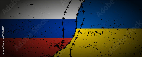 Grunge flags of Russian Federation and Ukraine divided by barb wire illustration. photo