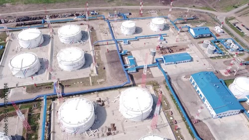 Base for storage of oil and oil products. Lots of tanks with lots of barrels of oil. Strategic object. The video was taken from a drone.
