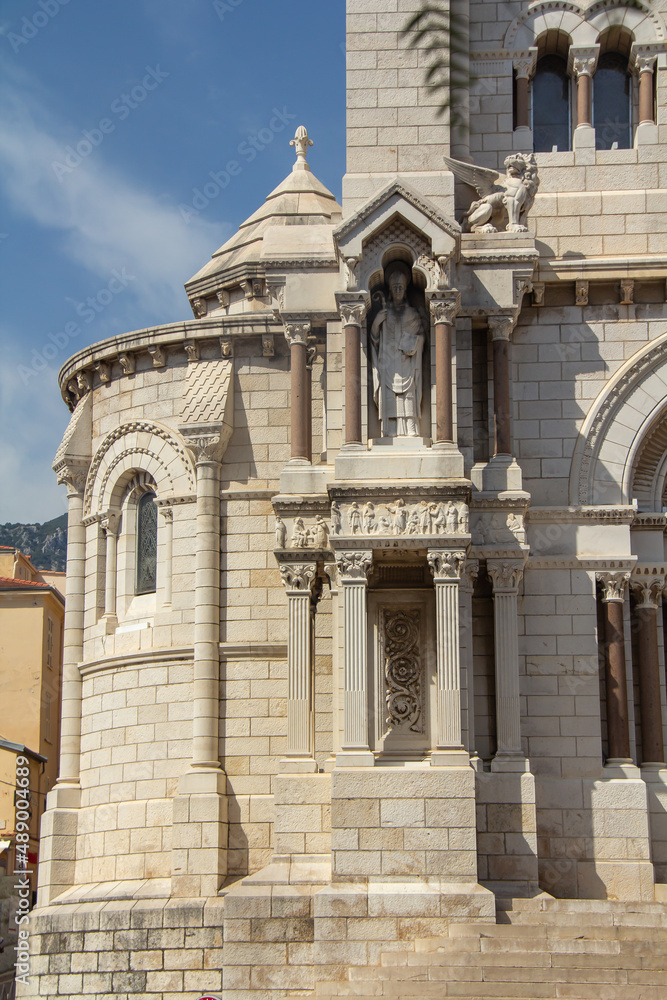 Detail of the outer walls of the church Cathedral of the Immaculate Conception Monaco. At the end on the roof are the symbols of the Evangelists. Romanesque Catholic Cathedral 