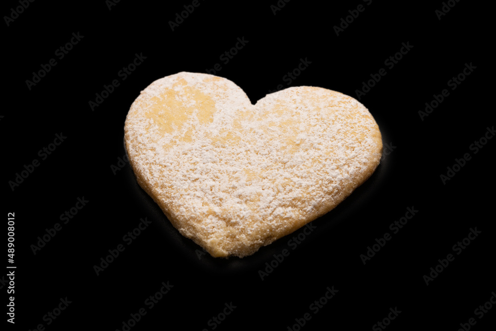 Shortbread in the shape of a heart isolated on white background. Shortbread in the shape of a heart isolated on white background.