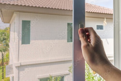 Hand hold mosquito net wire screen handle on house window